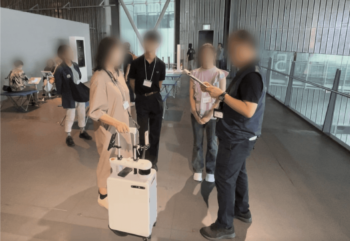 Robot assisted group tour for blind people.